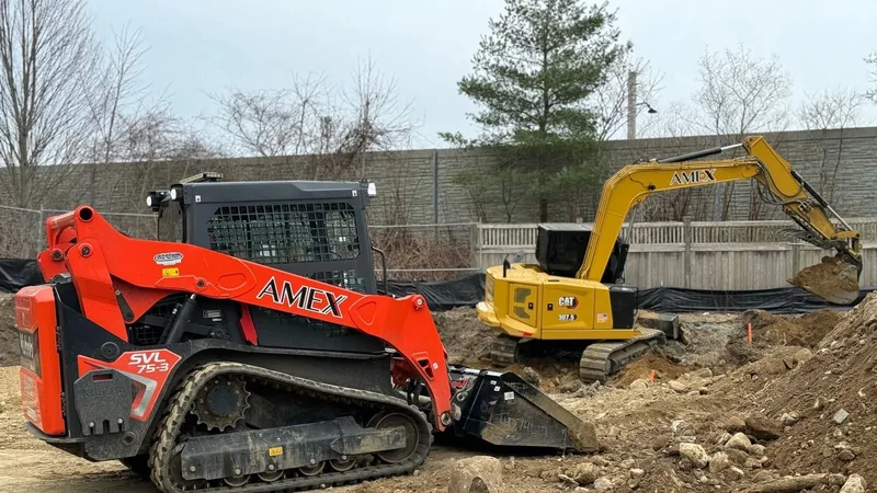 AMEX skid steer and excavator on a South Shore project site